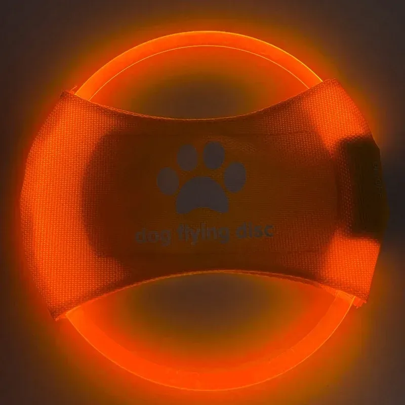 orange LED dog flying disc lit up