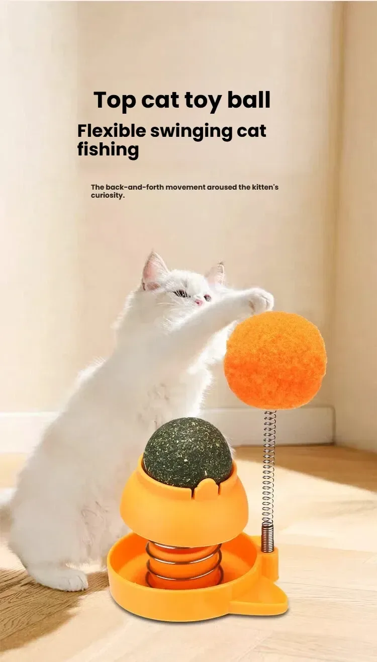 cat swatting the spring pom-pom of the catnip ball toy