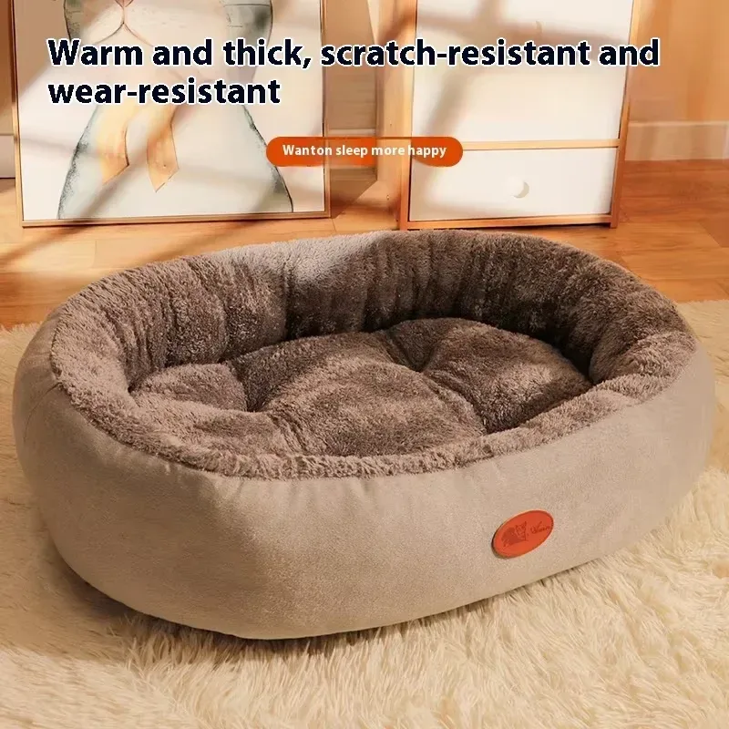 grey plush oval pet bed on a rug